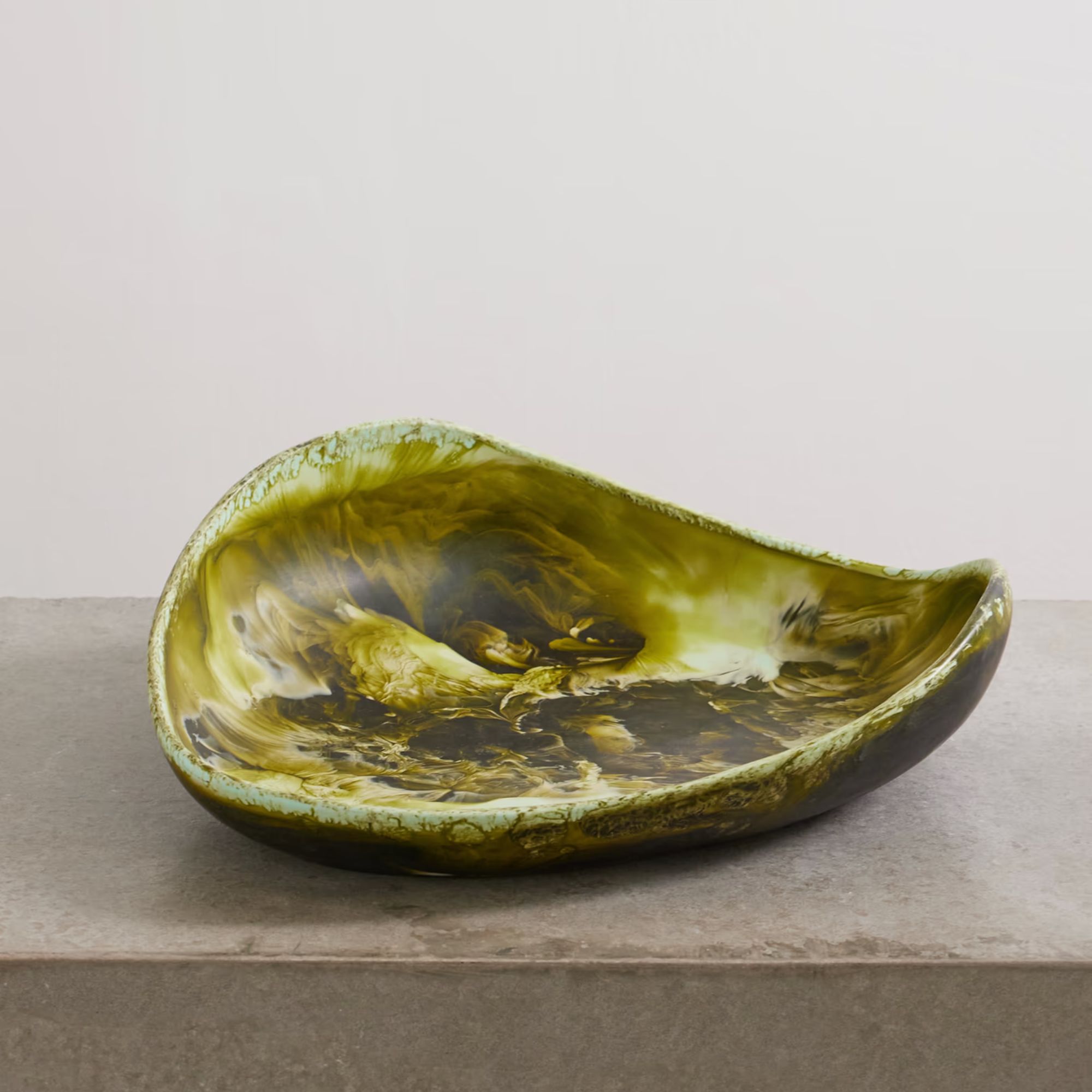 Green resin serving bowl with leaf shape and marbled finish