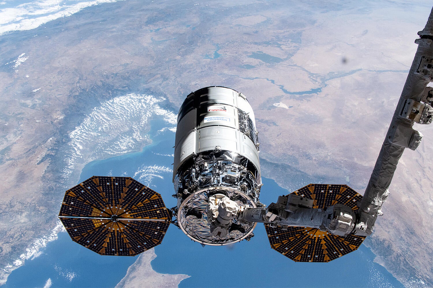 A file photo of a Northrop Grumman Cygnus cargo ship after capture by the International Space Station's robot arm during an earlier resupply mission. / Credit: NASA