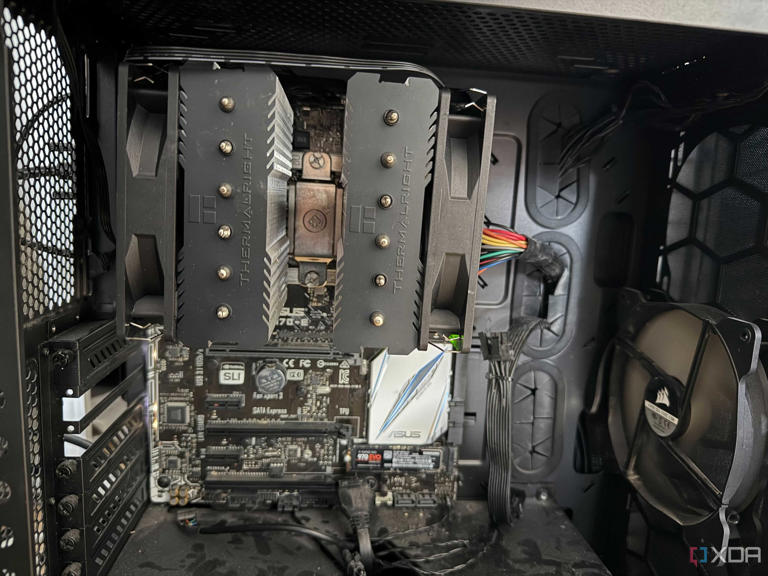 A photo of the inside of a PC, showing a CPU cooler with the fans attached incorrectly