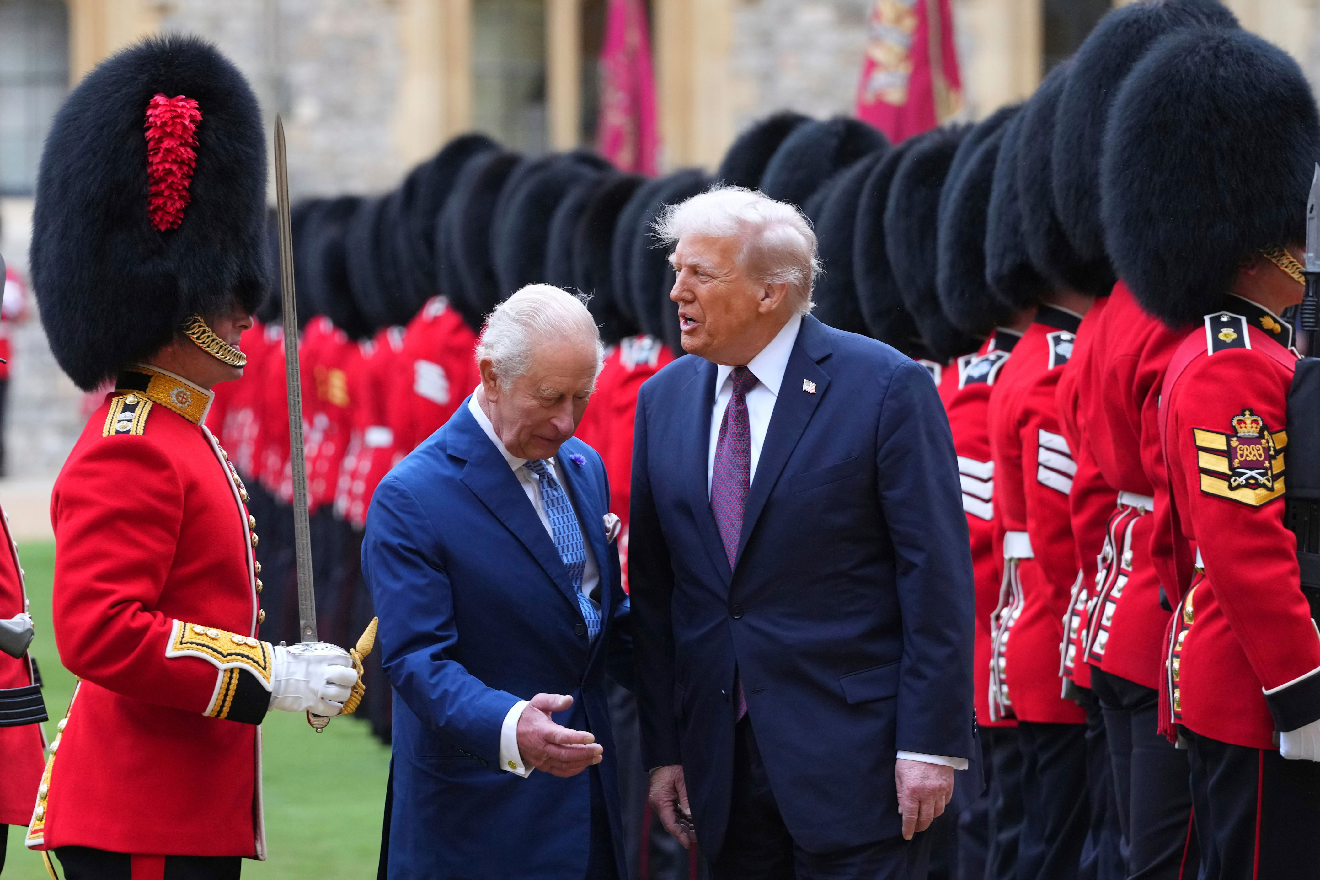 Trump reviews the Guard of Honour after his arrival at Windsor Castle, flanked by King Charles. / WPA Pool / Getty Images