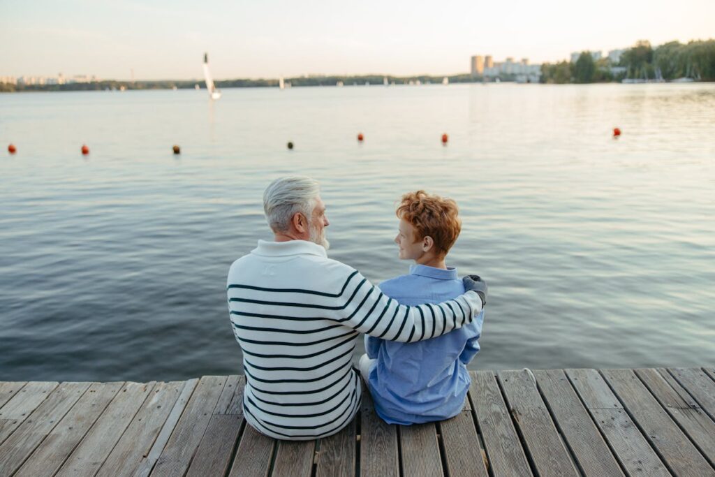 People Sitting on the Wooden Dock