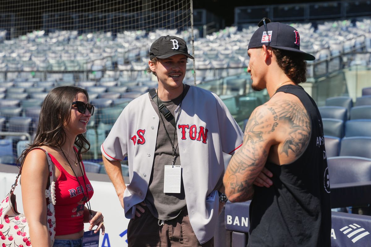 Isabel Machado and Christopher Briney talk to Red Sox player Jarren Duran