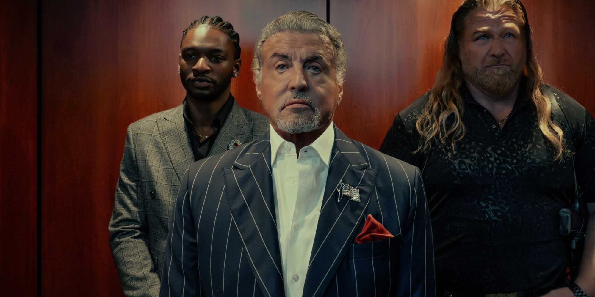 Sylvester Stallone as Dwight Manfredi flanked by Jay Will as Tyson Mitchell and Mike Walden as Bigfoot in Tulsa King season 3