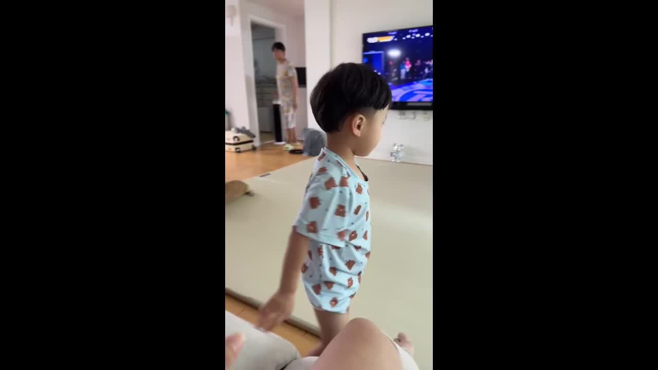 Little boy bumps head on sliding glass door in Seoul, South Korea