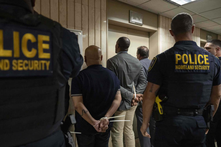 Federal agents detain the elected officials after they demand access to inspect the detainment facility at immigration court at the Jacob K. Javits federal building, Thursday, Sept. 18, 2025, in New York. (AP Photo/Yuki Iwamura)