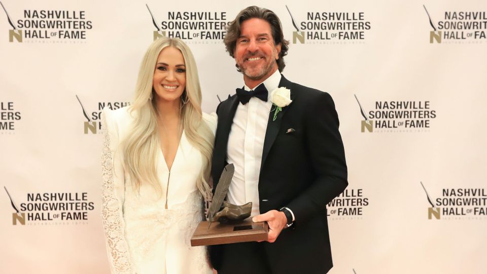 Brett James and Carrie Underwood pose for a photo in 2021 after James was inducted into the Nashville Songwriters Hall of Fame. - Bev Moser/Nashville Songwriters Hall of Fame