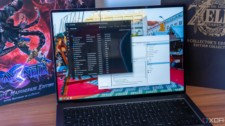 A Windows 11 laptop showing startup tasks in Task Manager and Task Scheduler