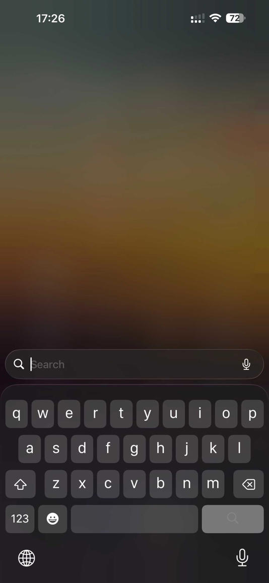 iPhone keyboard open in expanded mode.