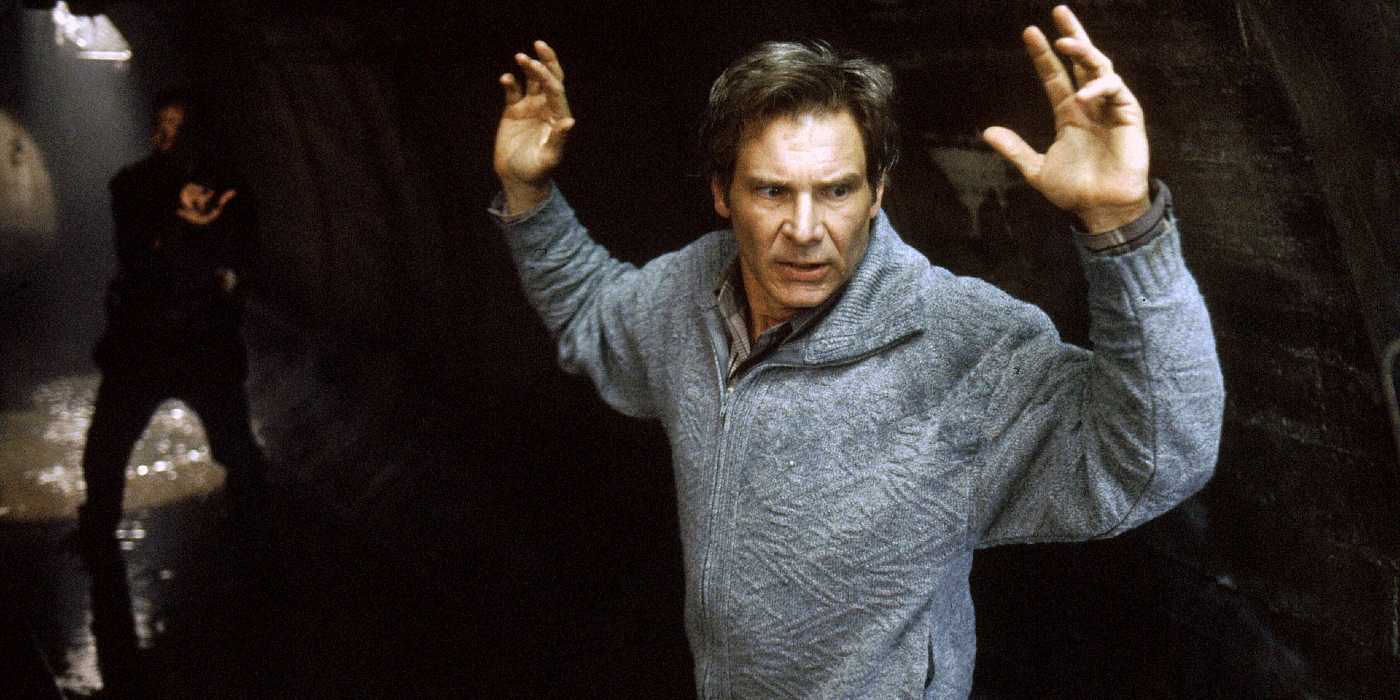 Richard Kimble holds his hands up in a tunnel in The Fugitive (1993)