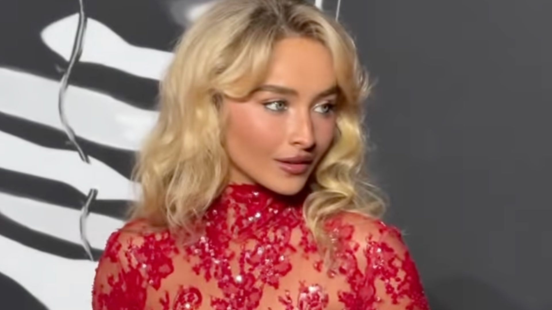 Sabrina Carpenter sets the ablaze in a breathtaking red lace gown