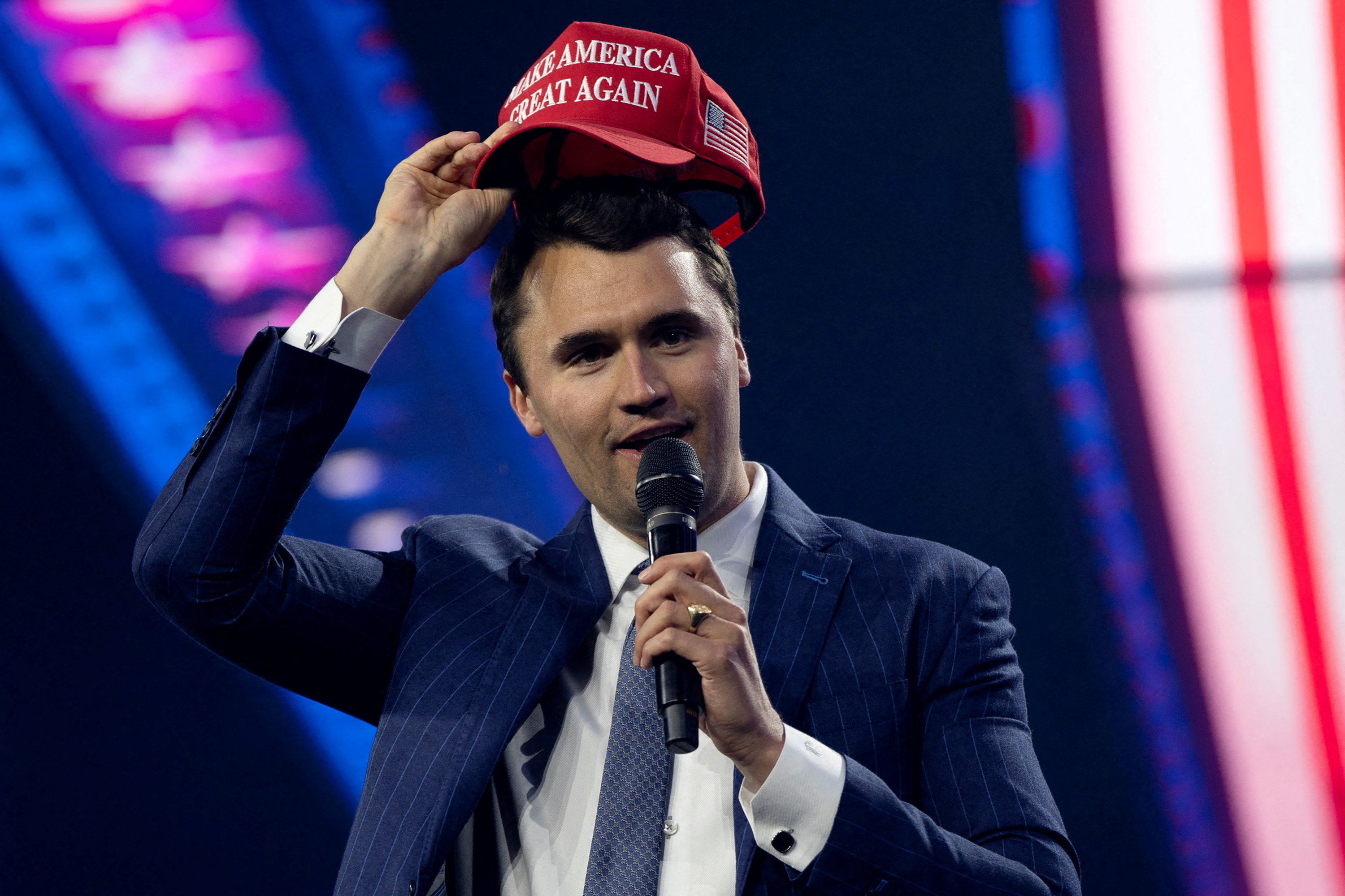 Charlie Kirk wearing a MAGA hat at AmericaFest in 2024 (REUTERS)