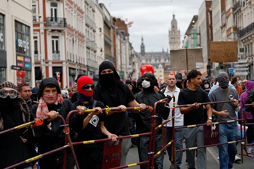 Protesters of the of the "Block Everything" movement setting a barricade during a rally in Lille, 10 September, 2025 AP Photo