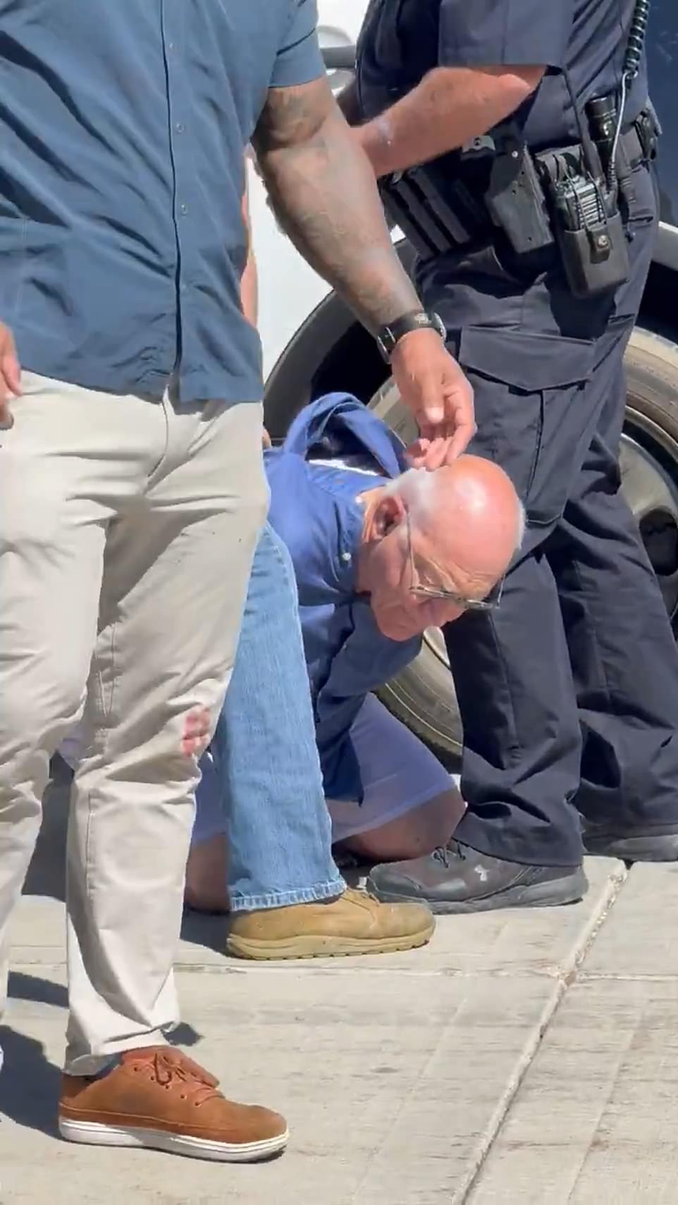 Suspected Charlie Kirk shooter dragged away by police