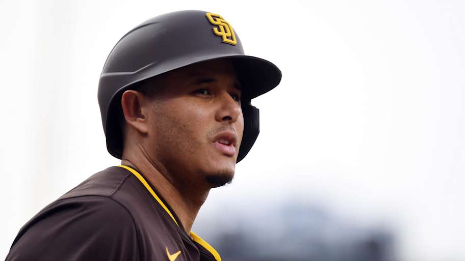 Manny Machado and Sal Stewart smiling and holding a baseball