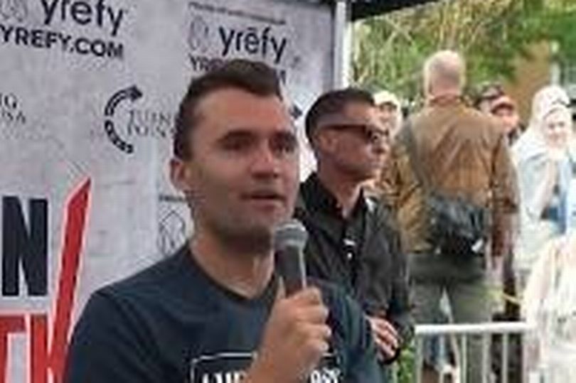 Charlie Kirk is pictured just before a sniper's bullet