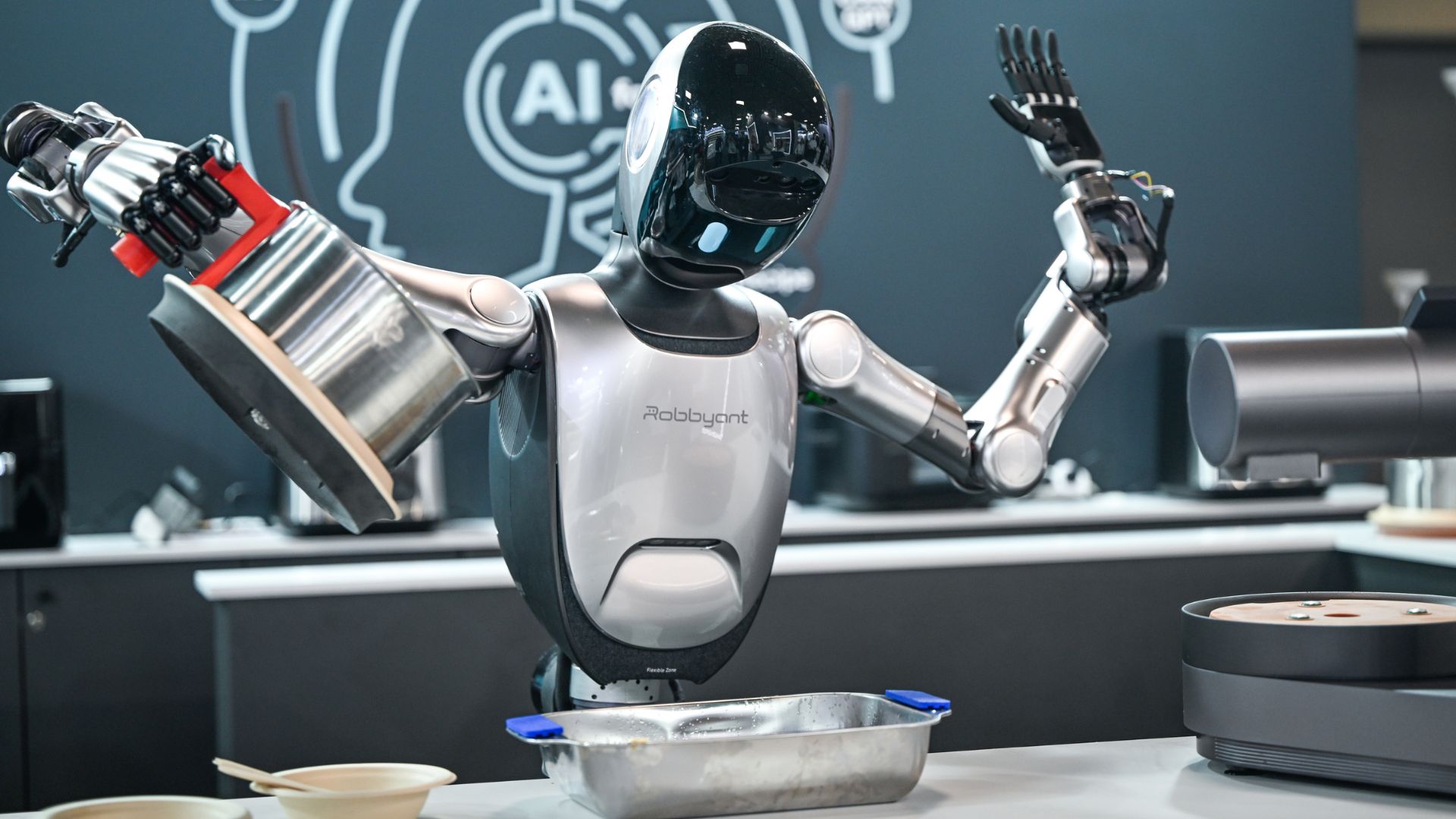 Jack Ma-backed firm unveils humanoid robot butler that can cook garlic ...