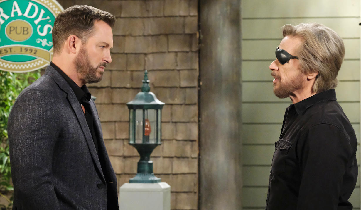 Brady and Steve tensely face each other outside the Pub