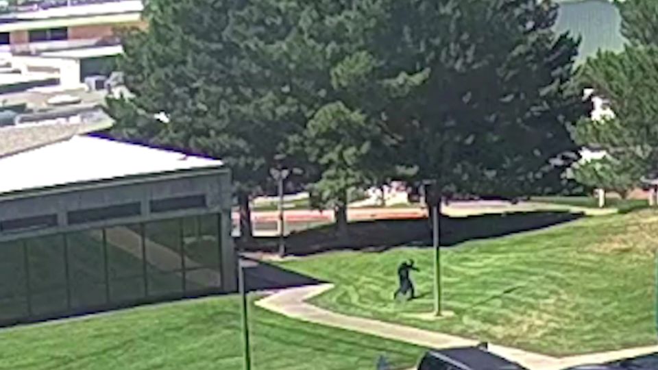 A still from a video released by the FBI of the shooter in Utah Valley. The subject is seen jumping from the rooftop of a building after the shooting. - FBI