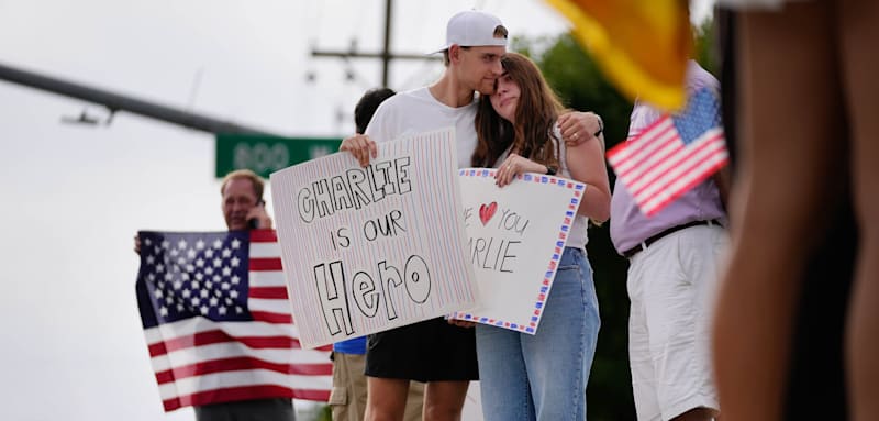 OREM, UTAH - SEPTEMBER 10: Seth and Jenny Hamby embrace as they gather gather outside Timpanogos Regional Hospital in Lehi in support of Charlie Kirk after he was shot and killed at Utah Valley University, They both attended the event at UVU and witnessed the shooting from a short distance away. on September 10, 2025 in Orem, Utah. (Photo by Francisco Kjolseth/The Salt Lake Tribune/Getty Images)