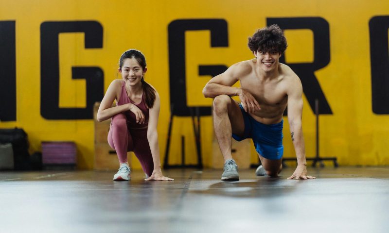 man woman stretching exercising working out