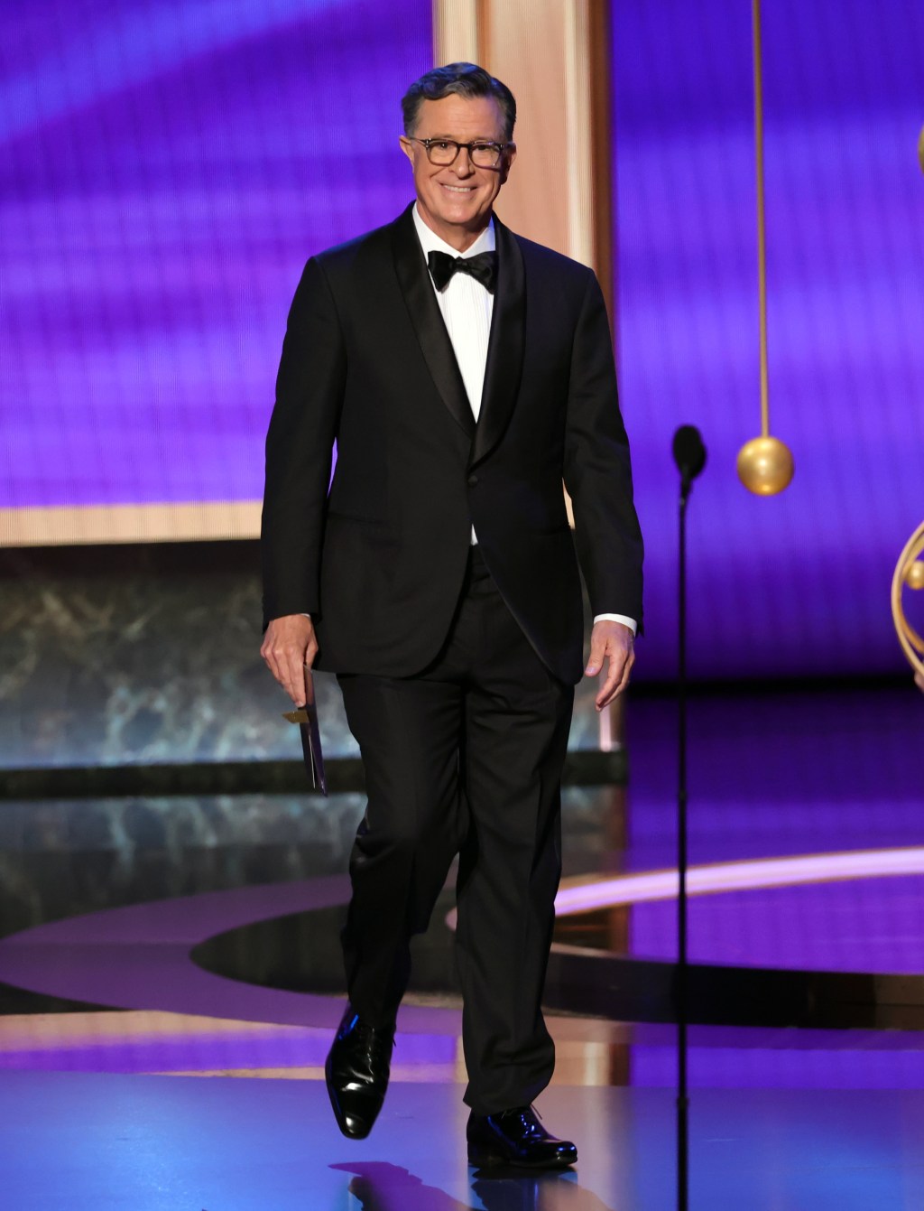 Stephen Colbert joked about being fired while presenting at the Emmy Awards. Getty Images