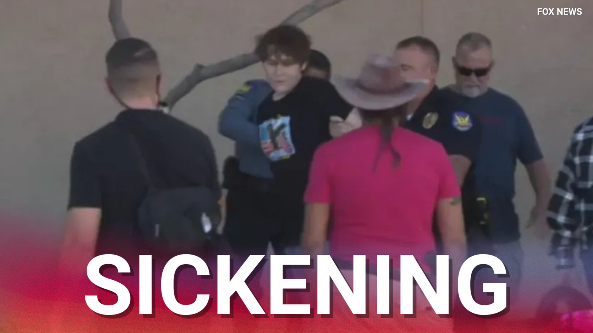 Agitator tackled to the ground and arrested after vandalising Charlie ...