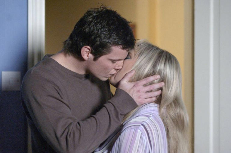 Dennis and Sharon kissing on EastEnders