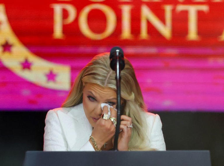 Erika Kirk gets emotional during a memorial service for her husband, slain conservative commentator Charlie Kirk, at State Farm Stadium in Arizona, U.S., September 21, 2025. REUTERS/Carlos Barria