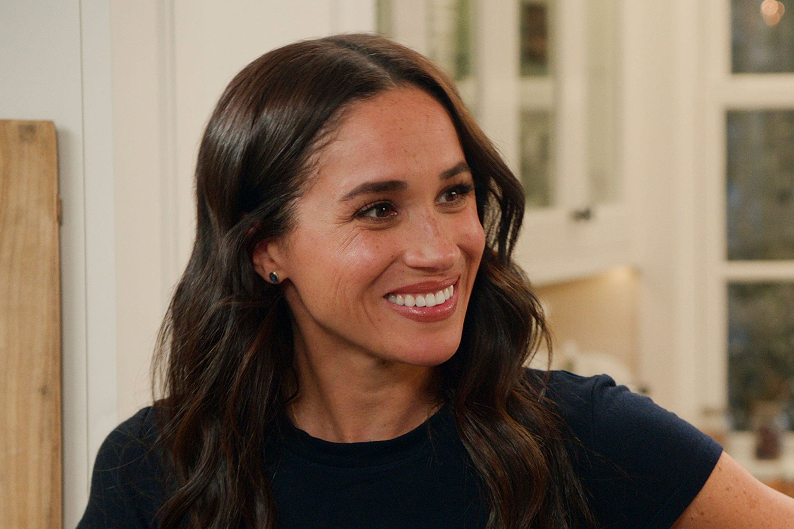 Meghan Markle smiles as she films the second season of her Netflix cooking show 'With Love, Meghan,' released in August 2025.