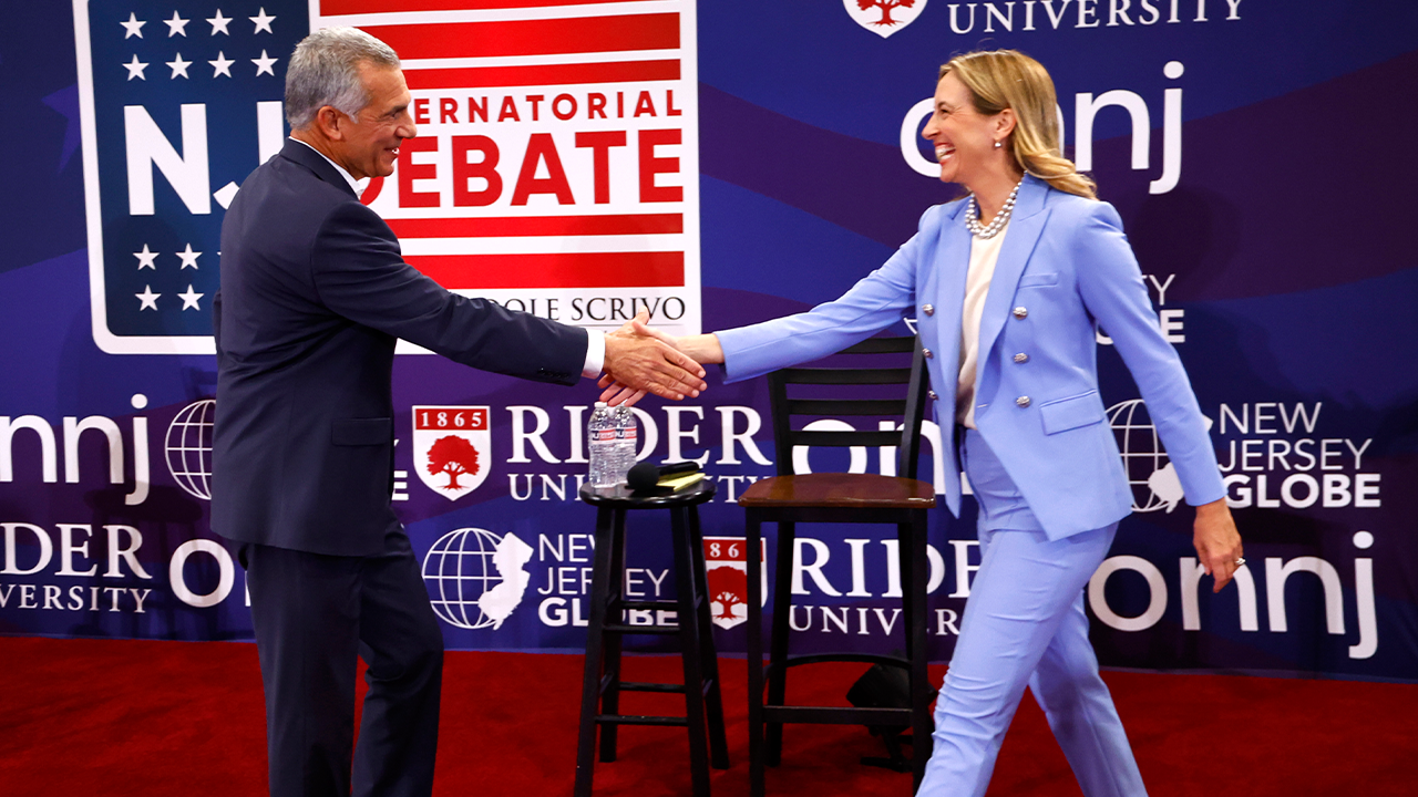 Republican candidate Jack Ciattarelli, left, shakes hands with Democratic candidate for governor Mikie Sherrill, right, before a debate on Sunday, Sept. 21, 2025, in Lawrenceville, N.J.