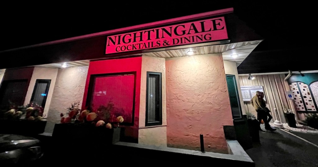 A red, backlit sign reading