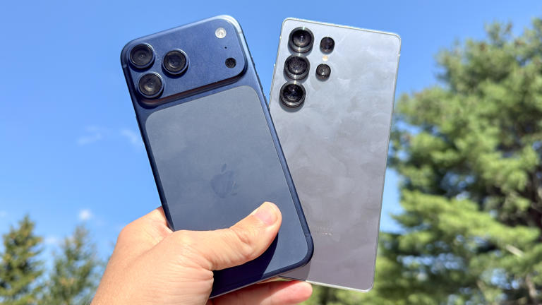 iPhone 17 Pro Max and Galaxy S25 Ultra held in the hand.