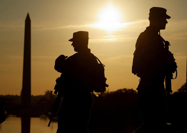 Daniel Becerril/Reuters - PHOTO: Members of the West Virginia National Guard patrol at the Lincoln Memorial in Washington, Sept. 23, 2025.