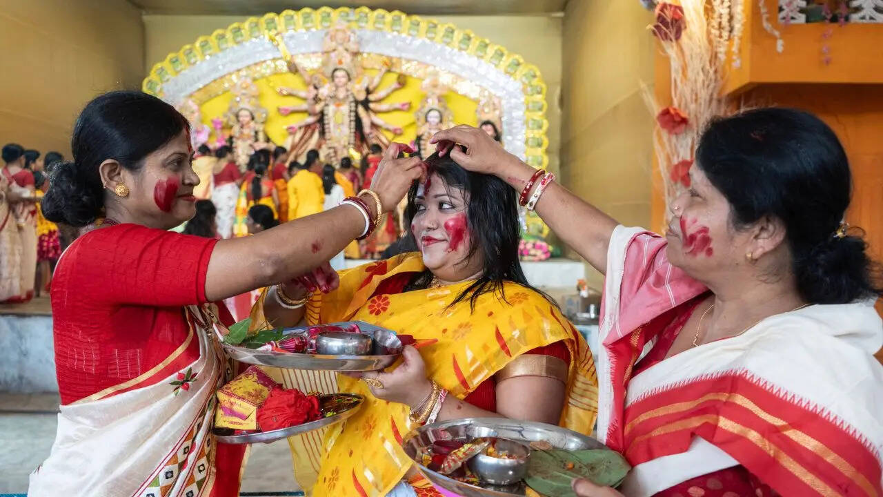 bijoya-dashami-2025-when-is-sindoor-khela-muhurat-rituals-and-meaning