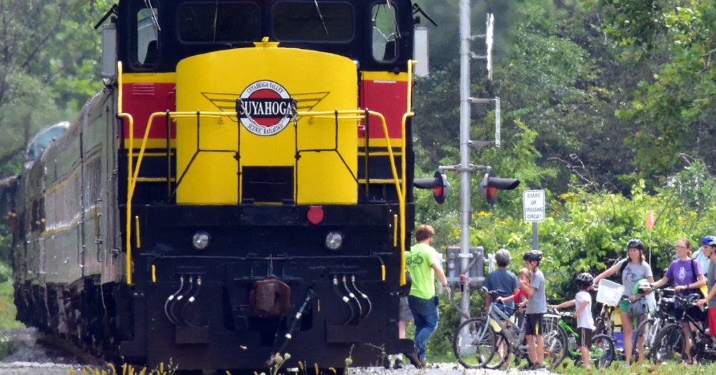 Bicyclists are boarding a train.