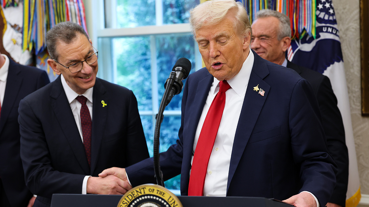 President Donald Trump shakes hands with Pfizer CEO Albert Bourla as he announces a deal with Pfizer to lower Medicaid drug prices in the Oval Office of the White House on September 30, 2025, in Washington, D.C. Getty Images