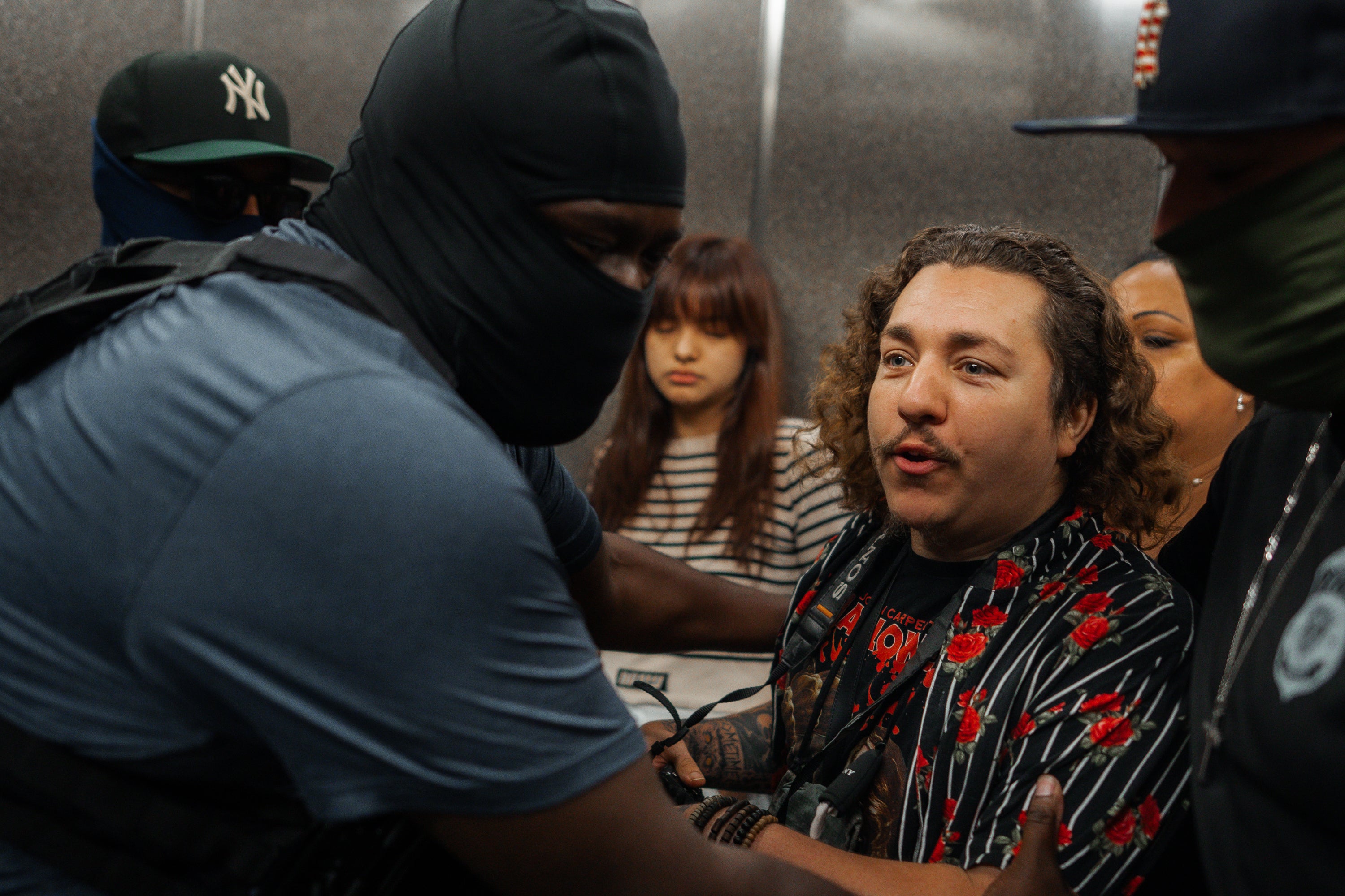 Photojournalist hospitalized after masked ICE agents throw reporters to(00)