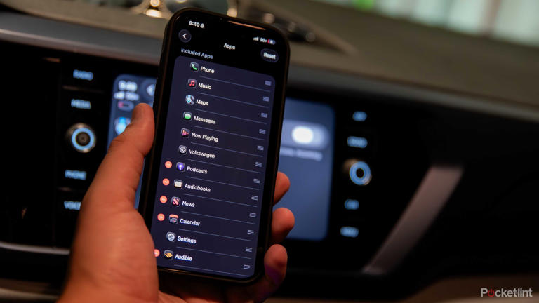 A still photo of an iPhone 16 Pro using CarPlay settings to rearrange apps in iOS 26.