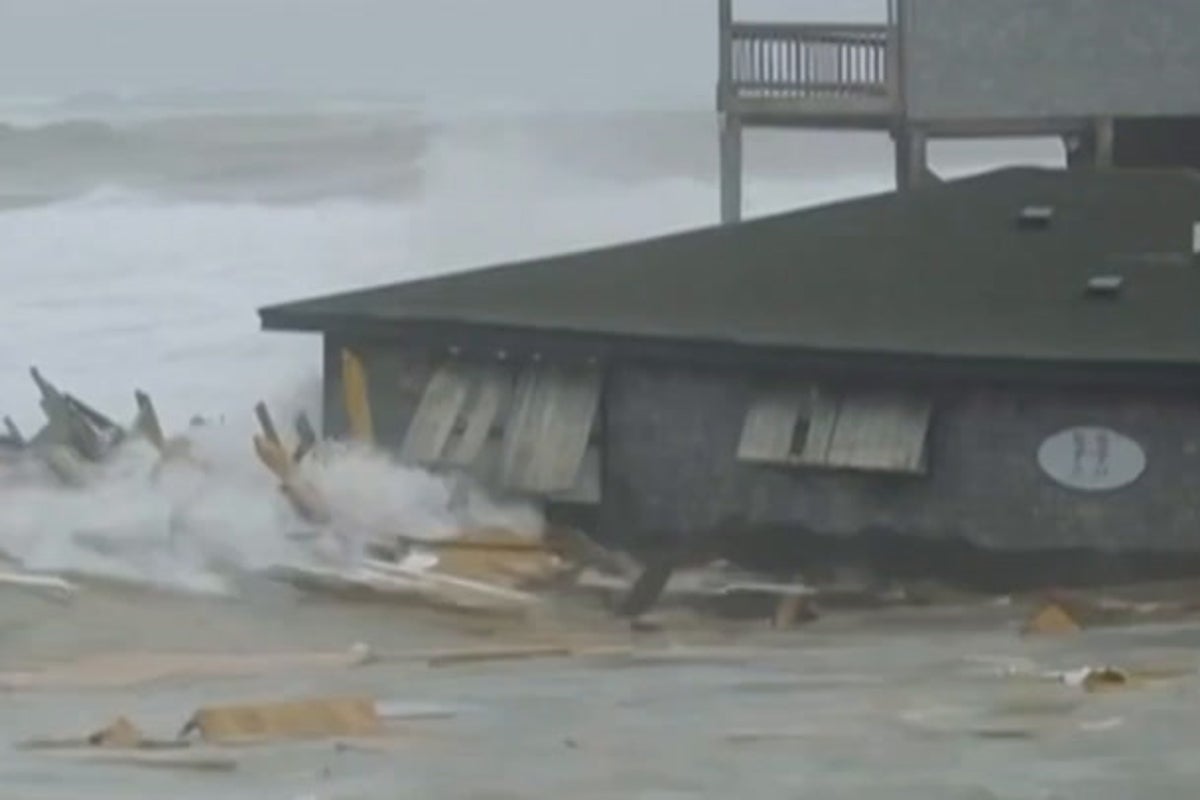 Beachfront homes collapse into the sea as hurricanes batter US coast