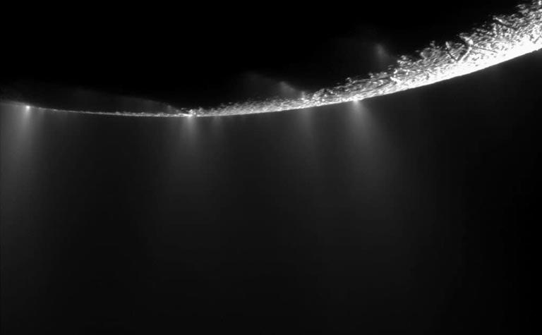 Narrow jets of gas and icy particles erupt from the south polar region of Enceladus, contributing to the moon’s giant plume. A cycle of activity in these small-scale jets may be periodically lofting extra particles into space, causing the overall plume to brighten dramatically. Image credits: NASA/JPL/Space Science Institute.