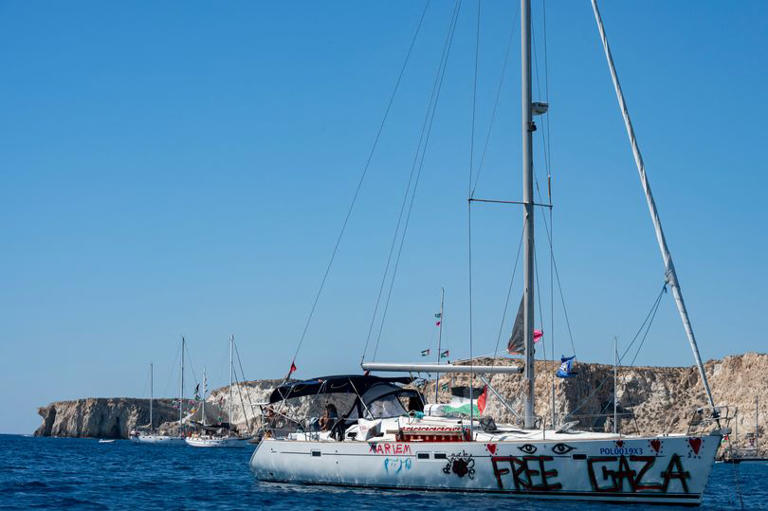 Members of the group of ships of the Global Sumud Flotilla to Gaza are seen moored at the small island of Koufonisi, south of the island of Crete, on September 26, 2025.