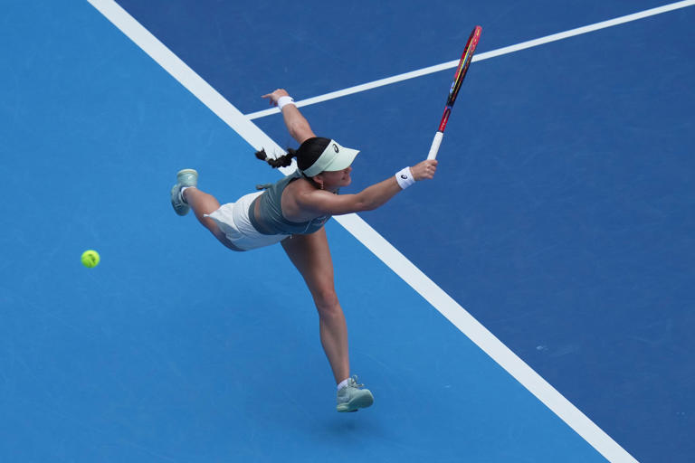 Eva Lys, of Germany misses the serves from Coco Gauff, of the United States during the women's singles quarterfinals match of the China Open tennis tournament, at the National Tennis Center, in Beijing, Thursday, Oct. 2, 2025. (AP Photo/Andy Wong)
