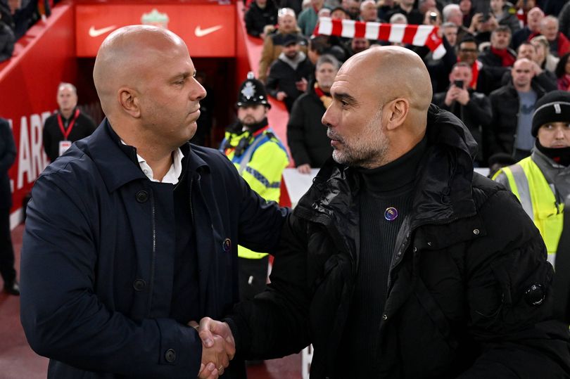 Arne Slot head coach of Liverpool meeting Pep Guardiola manager of Manchester City during the Premier League match between Liverpool FC and Manchester City