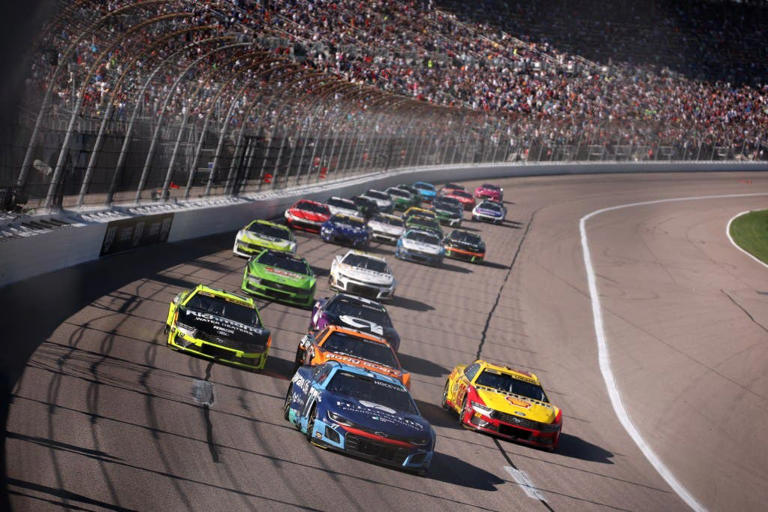 KANSAS CITY, KANSAS &ndash; SEPTEMBER 28: Carson Hocevar, driver of the #77 Delaware Life Chevrolet, Ryan Blaney, driver of the #12 Menards/Richmond Water Heaters Ford, and Joey Logano, driver of the #22 Shell Pennzoil Ford, race during the NASCAR Cup Series Hollywood Casino 400 Presented by ESPN BET at Kansas Speedway on September 28, 2025 in Kansas City, Kansas. (Photo by Chris Graythen/Getty Images)