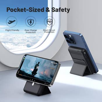 Phone stand with power bank displayed on airplane seat tray, showcasing a phone in upright position. Text highlights flight safety features