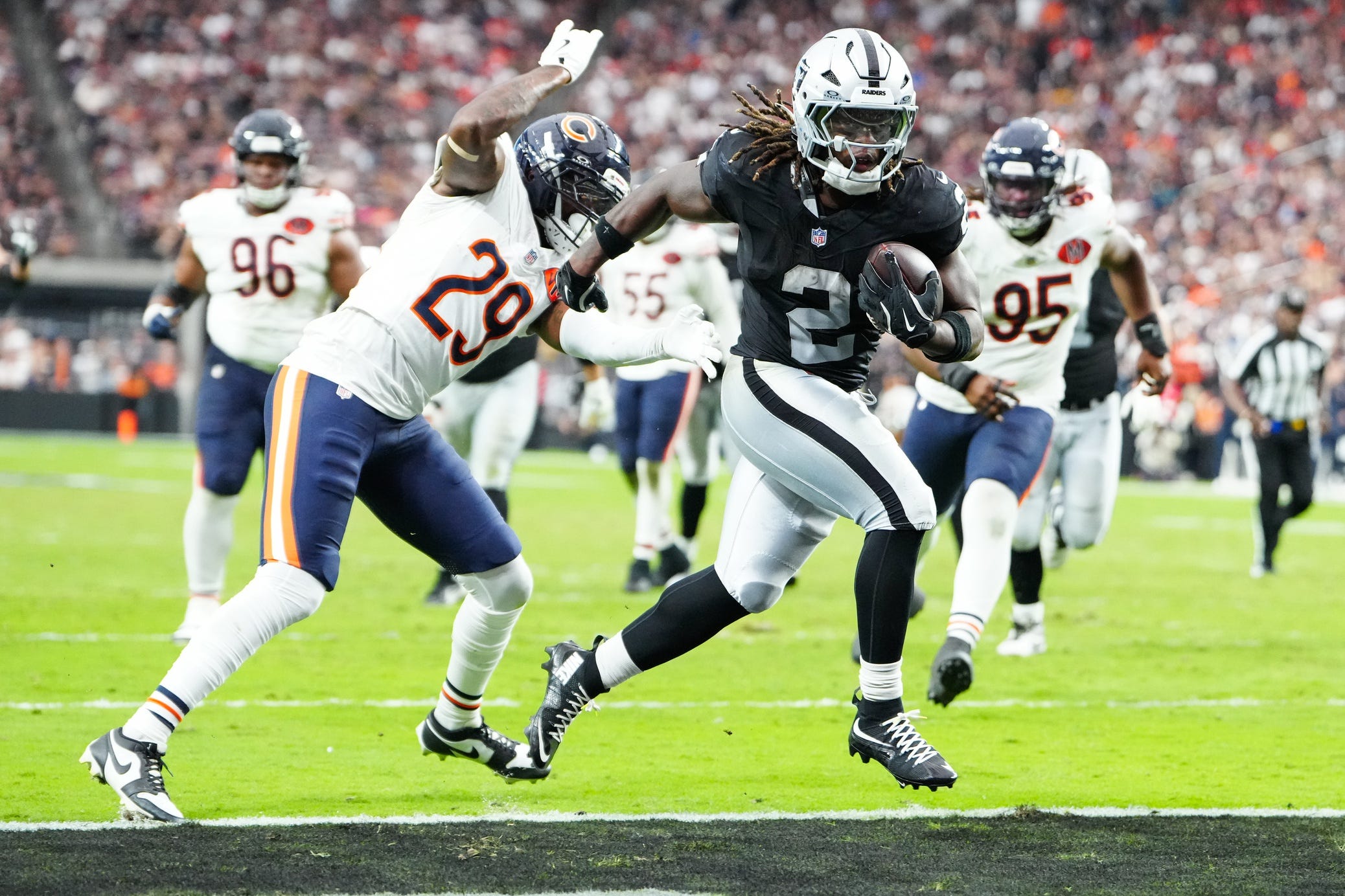 Sep 28, 2025; Paradise, Nevada, USA; Las Vegas Raiders running back Ashton Jeanty (2) runs the ball for a touchdown during the second half against the Chicago Bears at Allegiant Stadium. Mandatory Credit: Stephen R. Sylvanie-Imagn Images