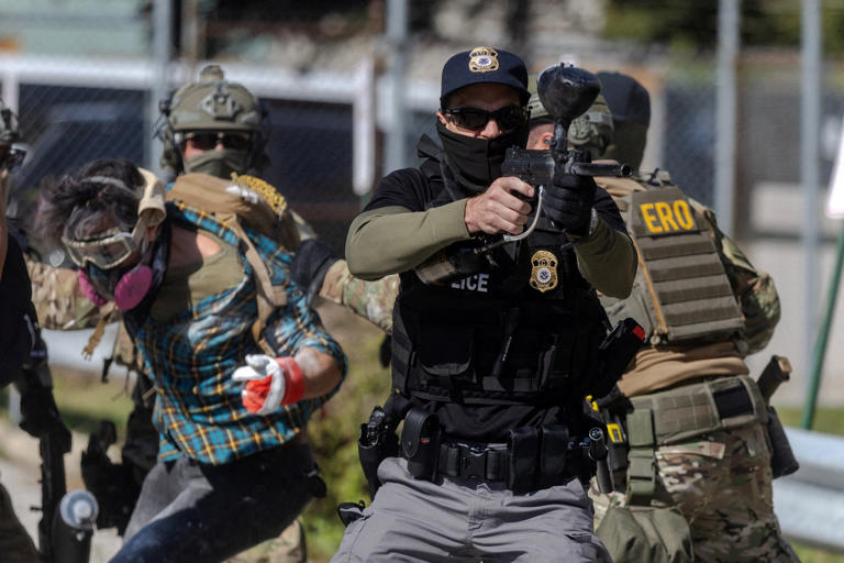 Federal agents detain a protester outside of the Broadview ICE processing facility, after President Donald Trump ordered increased federal law enforcement presence in Chicago to assist in crime prevention, in Broadview, Ill., Sept. 26, 2025.