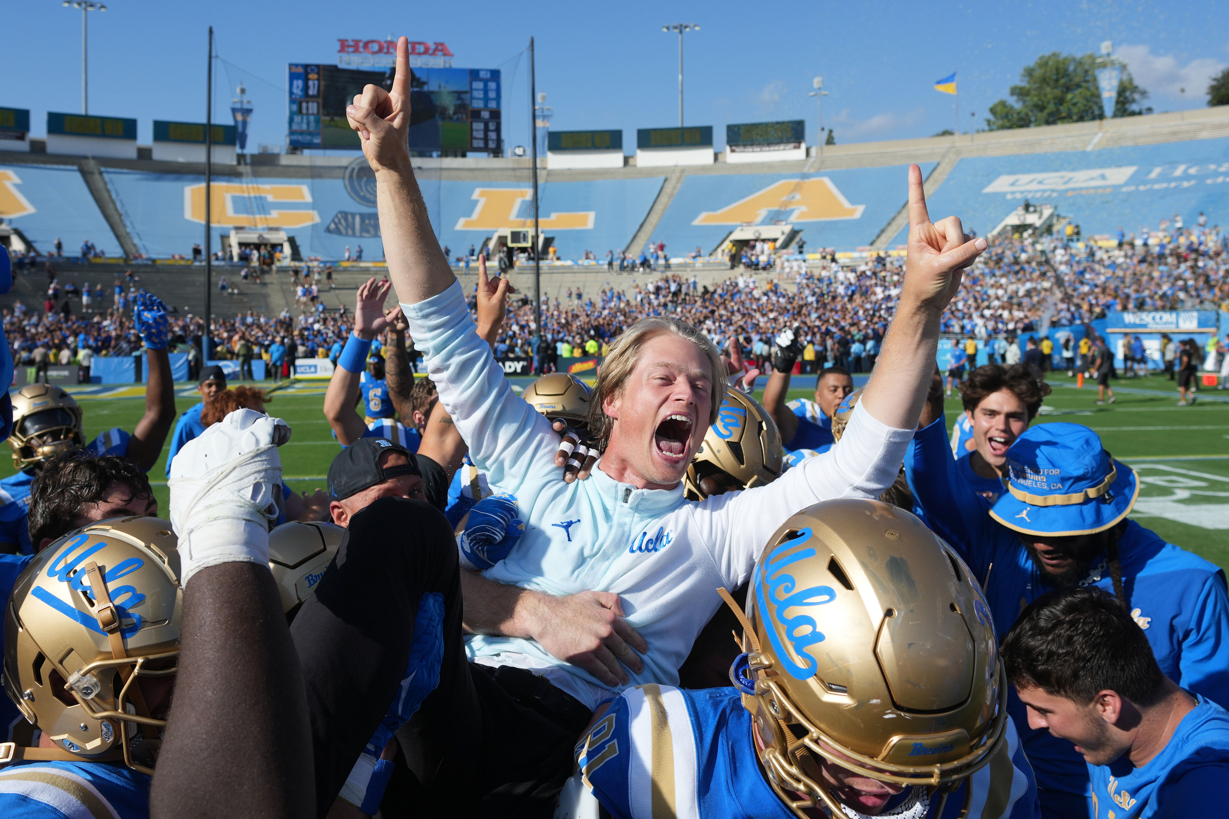 Rick Neuheisel celebrates son's playcalling debut during UCLA's upset