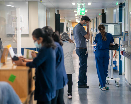 Staff on an NHS hospital ward in London. About one in five NHS staff in England are not British, according to official figures. Photograph: Jeff Moore/PA