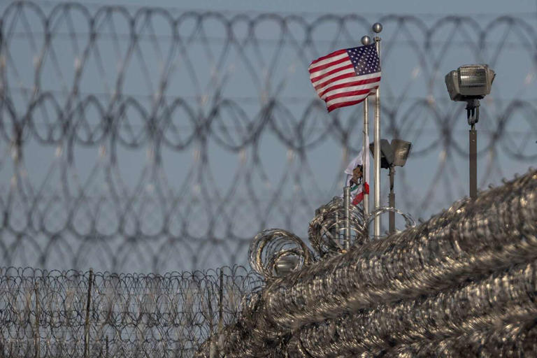 Detained immigrants protest over conditions inside newly opened ...
